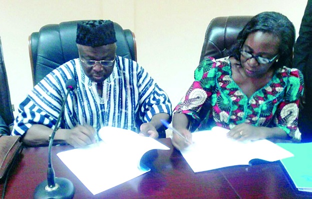 Prof. D.D Kuupole and Mrs Christine Bampoe Henaku signing the agreement Prof. D.D Kuupole and Mrs Christine Bampoe Henaku signing the agreement